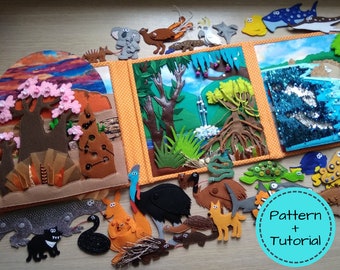 May include: A felt quiet book with Australian animal and landscape scenes. The book features a kangaroo, emu, and koala. The text "Pattern + Tutorial" is in a blue circle. The book is open, displaying colorful felt scenes.