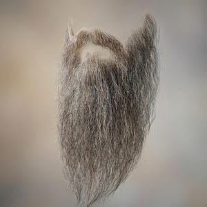 May include: A white ceramic mug with a black handle and the text "But First, Coffee" in a black, bold font. The mug is on a white surface. The mug is likely used for hot beverages.