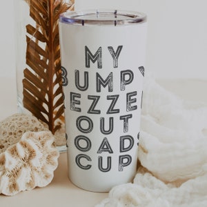 May include: White tumbler with a black graphic that says "My Bump Is Out Of Roads Cup".