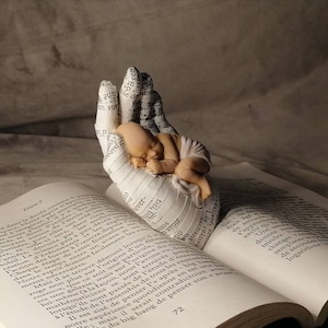 Book nook shelf insert baby in one hand