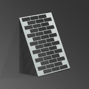May include: White stencil with a brick pattern. The stencil is made of a thin, flexible material and is designed to be used with paint or other mediums.