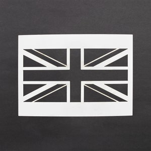 Puede incluir: Plantilla blanca de la bandera de la Union Jack, un símbolo británico, sobre un fondo negro.