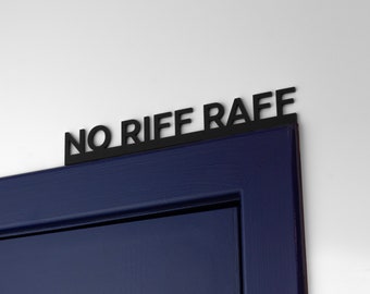 May include: A black metal sign with the words "NO RIFF RAFF" attached to the top of a dark blue door.