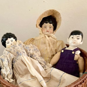 3 Vintage Low Brow German style Dolls, German Style Lowbrow porcelain dolls, Lot of 3 Vintage Porcelain Dolls in a Basket