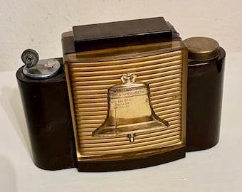 Dispensador de cigarrillos y encendedor Liberty Bell de la década de 1950 – Crucible Steel Casting Co.