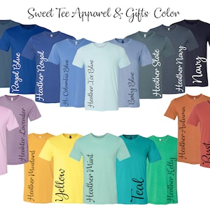 May include: A variety of t-shirt colors, including steel blue, royal blue, heather royal, heather columbia blue, heather ice blue, baby blue, heather slate, heather navy, navy, heather purple, lilac, heather lavender, heather mustard, yellow, heather mint, teal, heather kelly, heather autumn, rust, and red. Sweet Tee Apparel & Gifts Color.