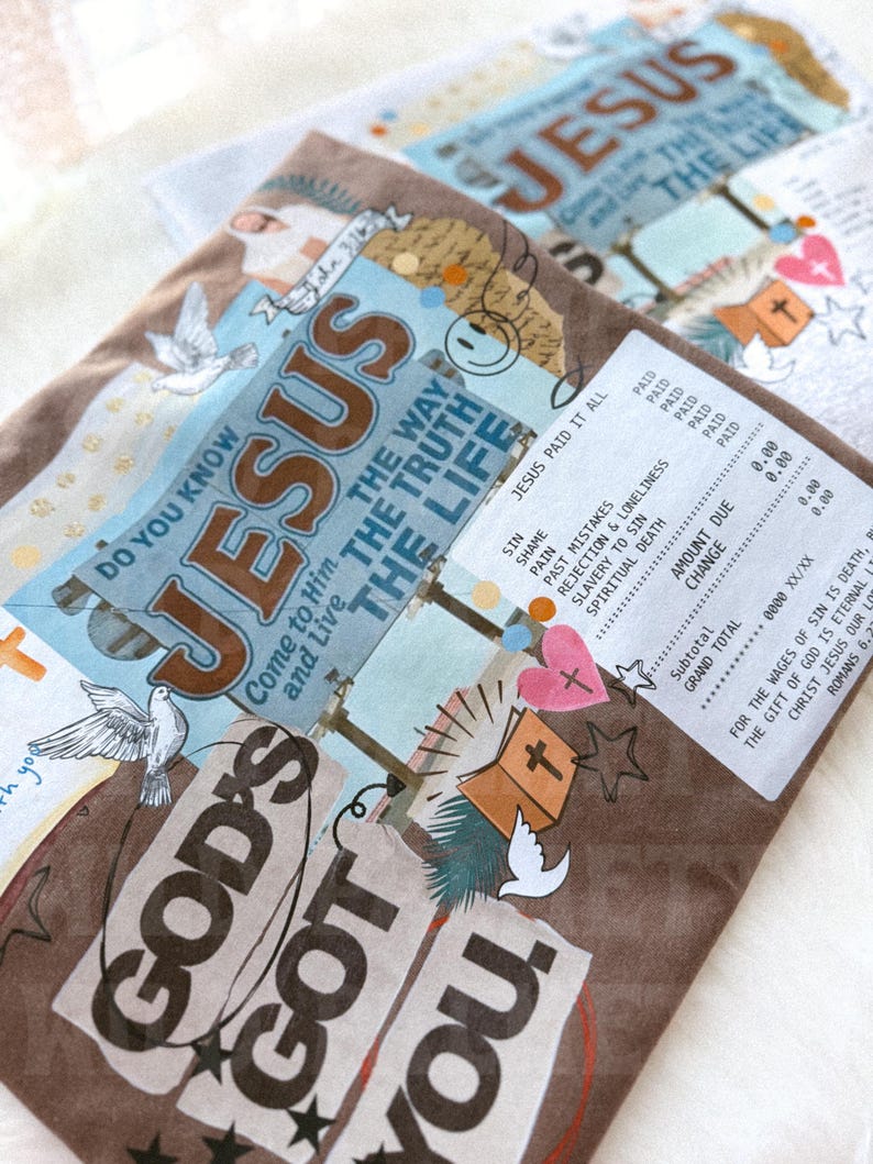 May include: Brown and blue religious-themed artwork with the words "JESUS" and "GOD'S GOT YOU." The design includes doves, a cross, and text that reads "JESUS PAID IT ALL." The artwork is layered with a receipt-like design.