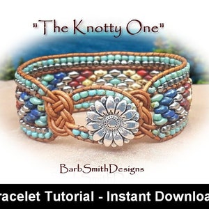 May include: A turquoise, red and silver beaded bracelet with a brown leather strap and a silver flower-shaped clasp. The bracelet is titled "The Knotty One".