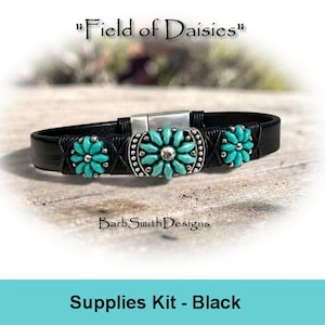 May include: A black leather bracelet featuring three turquoise-colored flower-shaped metal charms with silver-toned centers. The bracelet includes a silver-toned magnetic clasp and black cord wrapping. Text reads Field of Daisies and BarbSmithDesigns.