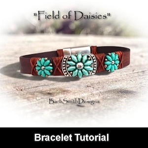 May include: A brown leather bracelet featuring three turquoise-colored flower-shaped beads with silver accents. The text Field of Daisies is printed above the bracelet, and the text BarbSmithDesigns is printed below it.