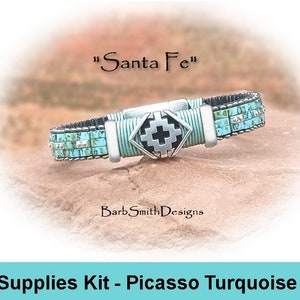 May include: A turquoise and silver beaded bracelet with a silver clasp. The bracelet is labeled "Santa Fe" and "BarbSmithDesigns". The bracelet is a supplies kit for making a Picasso Turquoise bracelet.