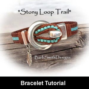 May include: Brown leather bracelet with turquoise beads and silver accents. The bracelet features a large silver buckle and a dangling feather charm. Text on the image reads "Stony Loop Trail" and "BarbSmithDesigns". The bottom of the image says "Bracelet Tutorial".
