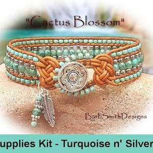 May include: A turquoise and silver beaded bracelet kit with a leather strap, a silver button closure, and a feather charm. The kit is labeled "Cactus Blossom" and "Supplies Kit - Turquoise n' Silver".