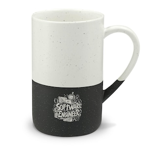May include: A two-toned ceramic mug with a speckled white top half and a solid black bottom half. The black section features a white graphic illustration of a small robot and computer code elements with the text SOFTWARE ENGINEER.