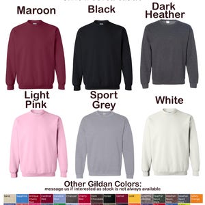 May include: Colour chart for Gildan sweatshirts showing different colours, including maroon, black, dark heather, light pink, sport grey, and white. The chart also includes a list of other Gildan colours.