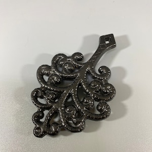 Vintage JZH cast iron family tree footed trivet wall hanging