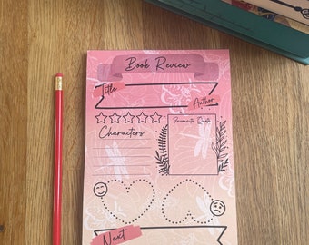 May include: A pink and orange book review template with a dragonfly design. The template has sections for title, author, rating, characters, favorite quote, and next.