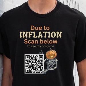 May include: Black t-shirt with a white graphic that says "Due to INFLATION Scan below to see my costume" and a QR code with a skeleton holding a pumpkin.
