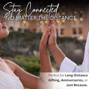 May include: Two people holding hands with the text "Stay Connected No Matter The Distance" above them. The text "Perfect for Long-Distance Gifting, Anniversaries, or Just Because." is below them.