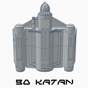 May include: A gray 3D model of a spaceship with a domed top and a rectangular body. The model is labeled "BO KATAN".