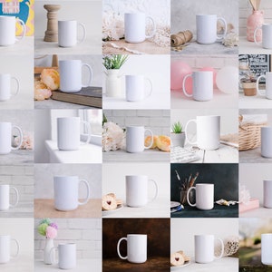 May include: A collection of 25 white ceramic mugs with handles. The mugs are arranged in a grid pattern on a white background. Some of the mugs are on different surfaces, such as wood, brick, and fabric.