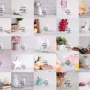 May include: A collection of 20 clear glass wine tumblers with the text "YOUR design HERE" printed on each. The tumblers are displayed against a variety of backgrounds, including wood, fabric, and plants.