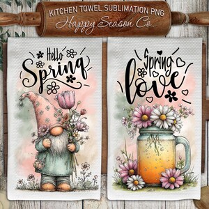 May include: Two white kitchen towels with spring-themed designs. One features a gnome holding flowers with "Hello Spring" text. The other shows a mason jar with flowers and "Spring Love" text. A wooden rolling pin is at the top.