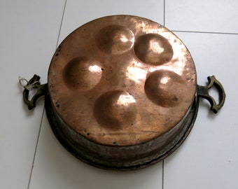 Old copper snail pan