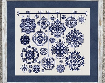 May include: A white background with a blue frame surrounding a design of 18 blue snowflake ornaments hanging from a string. The snowflakes are all different designs.