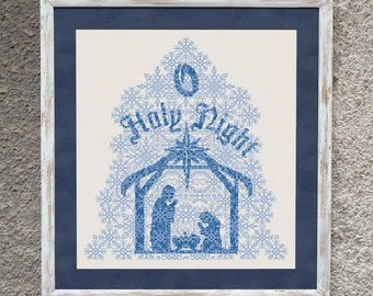 May include: A framed cross-stitch design featuring a blue and white nativity scene with the words "Holy Night" in a blue font.