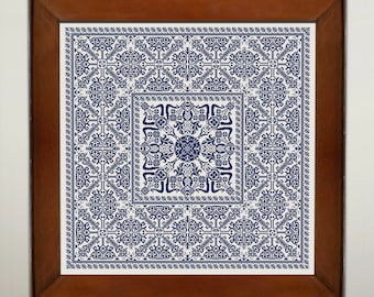 May include: A framed piece of needlepoint embroidery with a blue and white geometric pattern. The design features a central square with a floral motif surrounded by repeating patterns.