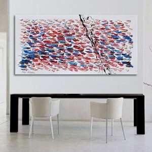 Puede incluir: Pintura abstracta con fondo blanco y una l&iacute;nea negra que recorre el centro. La pintura est&aacute; compuesta por peque&ntilde;as pinceladas de colores en tonos rojos, azules y amarillos.