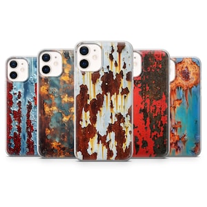 May include: A collection of five phone cases with a weathered, distressed metal design. The cases feature a variety of colors, including red, blue, brown, and white, creating a rustic and industrial aesthetic. The cases are designed to fit a smartphone.