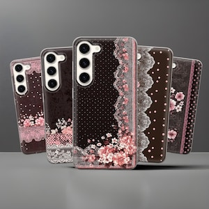 May include: A collection of five phone cases with floral and lace designs. The cases feature a dark brown background with white polka dots, pink flowers, and delicate lace trim. Each case has a different design, with varying floral arrangements and lace patterns.