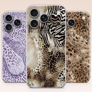 May include: Three smartphone cases featuring animal print designs. The left case has a purple leopard pattern, the centre case displays a mix of zebra stripes and leopard spots, and the right case shows a realistic brown and black leopard fur pattern.