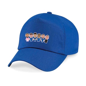 May include: A royal blue baseball cap with an embroidered design of a group of cartoon football players.