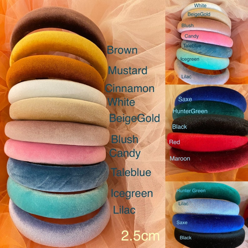 May include: A collection of padded velvet headbands in various colors, including brown, mustard, and pink. The headbands are 2.5cm wide and are displayed against a soft, peach-colored background. Color names are listed alongside each headband.