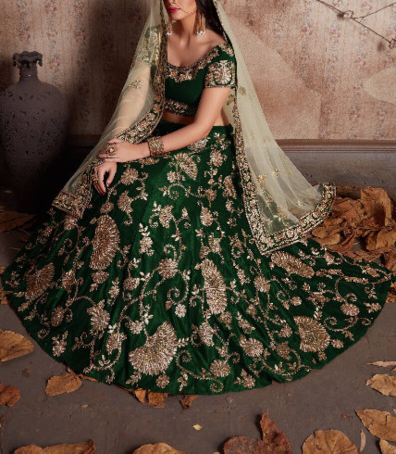 bottle green lehenga with red dupatta