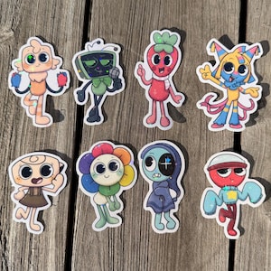 May include: A collection of eight holographic stickers featuring colorful cartoon characters with unique designs. The stickers include a variety of creatures, each with distinct features and vibrant color schemes, set against a wooden background.