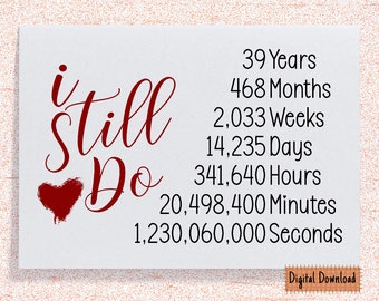 May include: A red heart with the words "i still do" in red cursive script. The image also includes a list of time measurements in years, months, weeks, days, hours, minutes, and seconds.