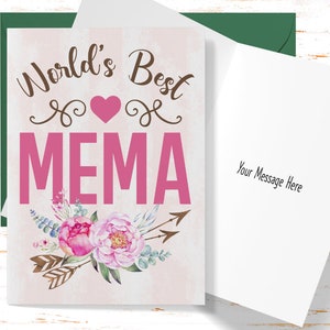 May include: A greeting card with a pink and white floral design. The card says "World's Best MEMA" with a pink heart in the middle. The inside of the card is blank for writing a message.
