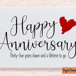 May include: A white card with black text that reads "Happy Anniversary" with a red heart graphic and the text "Thirty-five years down and a lifetime to go".