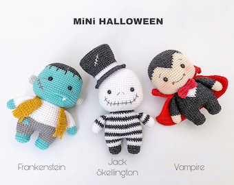 May include: Three crocheted Halloween characters: Frankenstein, Jack Skellington, and a vampire. Frankenstein is teal and gray with a yellow scarf. Jack Skellington is white and black with a black top hat. The vampire is black and red with a red cape.
