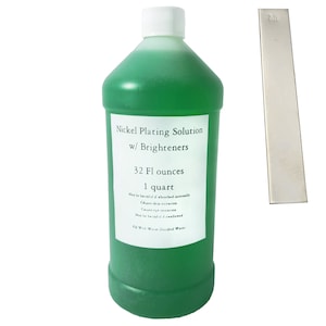 May include: A green bottle of nickel plating solution with brighteners. The bottle is labelled with the text "Nickel Plating Solution w/ Brighteners", "32 Fl ounces", and "1 quart".