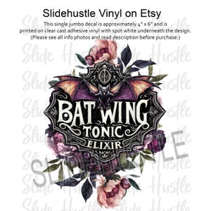 May include: A purple and black decal with a bat and the text "Bat Wing Tonic Elixir" surrounded by dark pink and purple flowers.