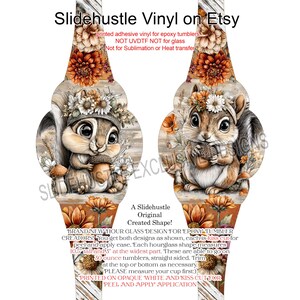 May include: Adhesive vinyl for epoxy tumblers featuring two designs with a squirrel holding an acorn, surrounded by flowers and autumn foliage. The text "Slidehustle Vinyl on Etsy" is at the top. Each hourglass shape measures 10.5 inches tall and 3 inches at the widest part.