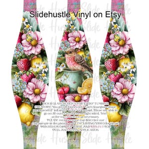 May include: Hourglass-shaped tumbler wraps with a floral and bird design. The wraps feature pink flowers, strawberries, lemons, and a bird perched on a teacup. The text "Slidehustle Vinyl on Etsy" is at the top. Each wrap measures 10.5 inches tall and 3 inches at the widest part.