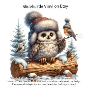 May include: A white owl wearing a blue and brown winter hat sits on a snowy log with two small birds. The owl is looking to the right. The decal is approximately 3.50" x 3.50".