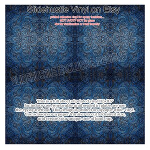 May include: A full sheet of printed vinyl for epoxy tumblers, featuring a detailed blue and silver floral pattern. The text on the sheet reads "Slidehustle Vinyl on Etsy" and includes instructions for use. The sheet measures 11.5 x 11.5 inches.