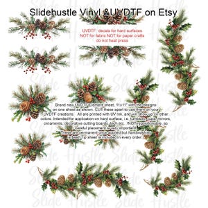 May include: A sheet of UVDTF decals featuring Christmas-themed designs. The decals include pine branches, pine cones, and red berries. The text on the sheet reads "Slidehustle Vinyl & UVDTF on Etsy" and "UVDTF decals for hard surfaces".